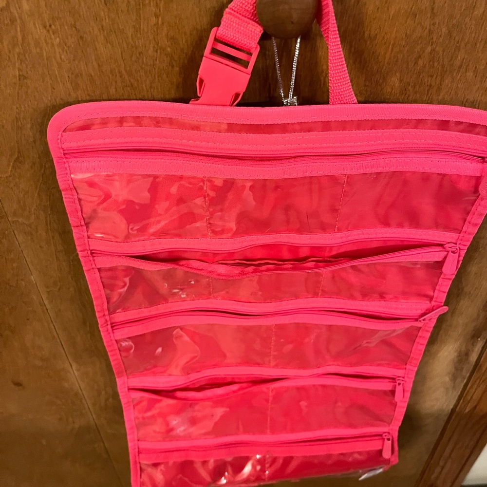 Thirty one jewelry organizers, pink color , measures 12 x 24 inches.